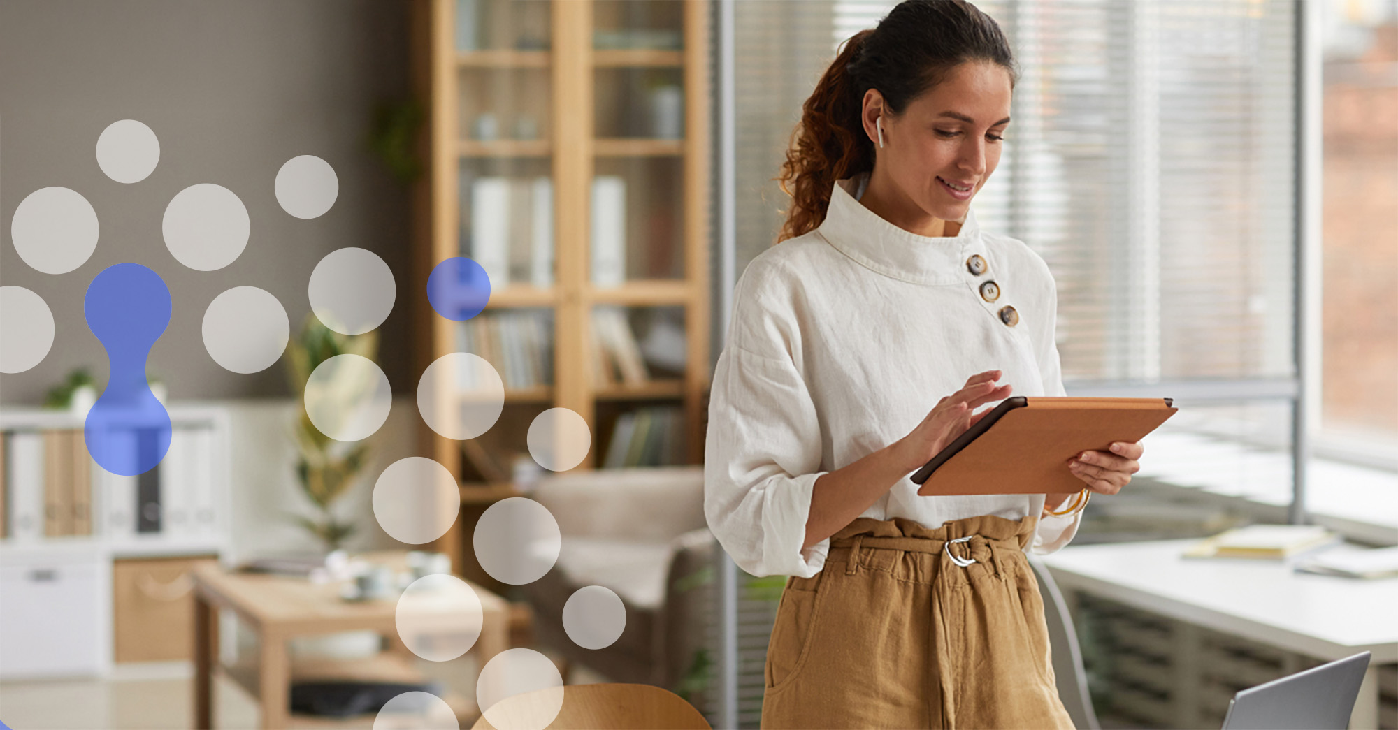 Professional uses SpecBooks Basic on tablet: creating quotes, specification books, and picture portfolios simultaneously with enriched product data for efficient construction workflows.