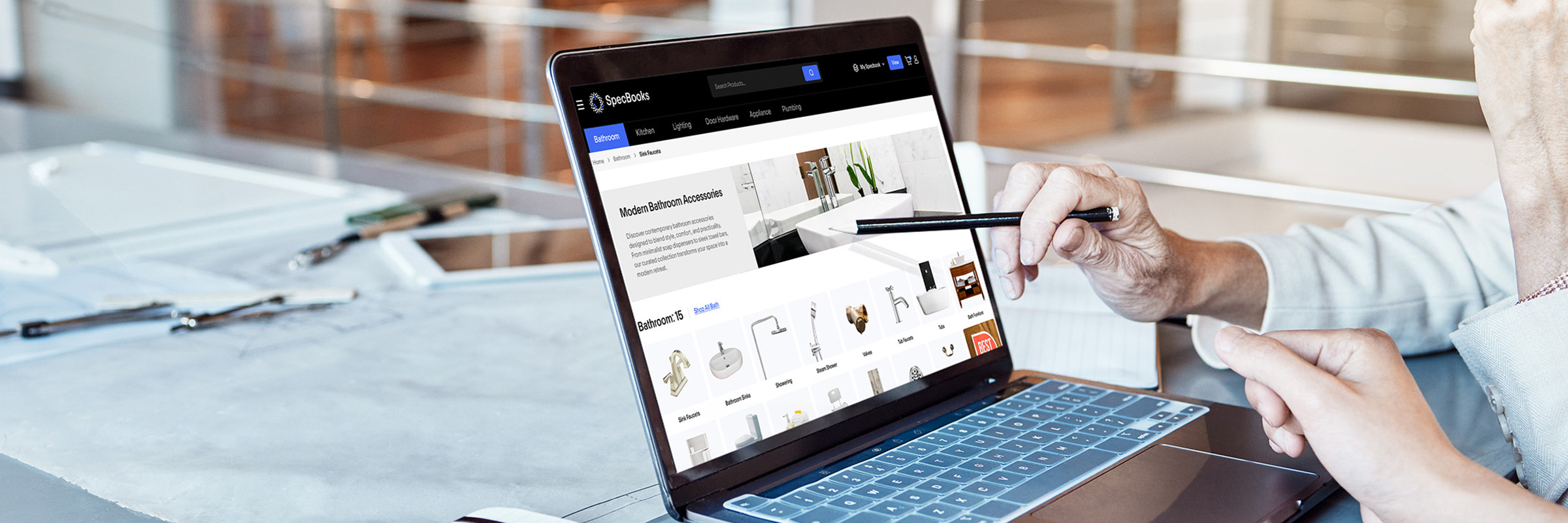 Showroom professional uses SpecBooks Market e-commerce platform on laptop: browsing modern bathroom accessories, real-time sourcing, and digital storefront for white-labeled dropshipping and online sales.